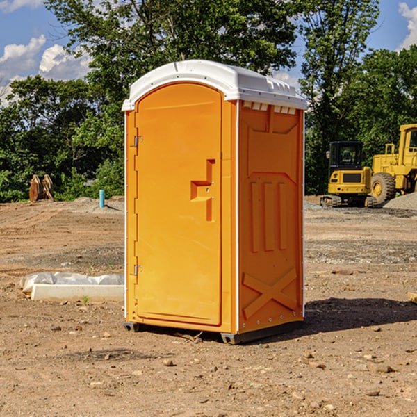 how often are the portable restrooms cleaned and serviced during a rental period in Leland MI